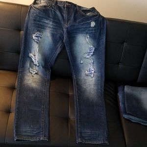 Distressed and repaired slim jeans
